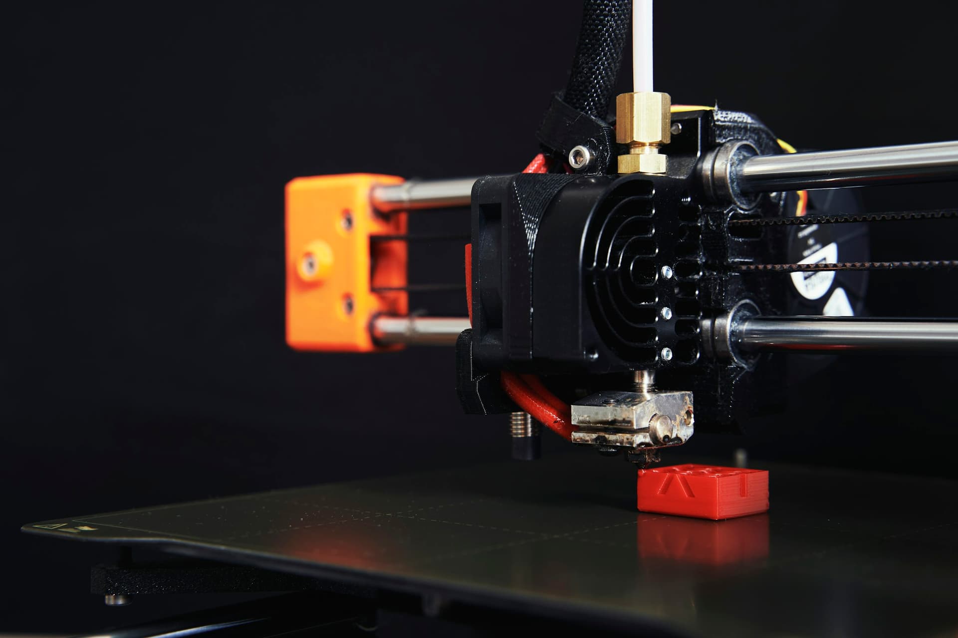 Close-up of a 3D printer nozzle at work